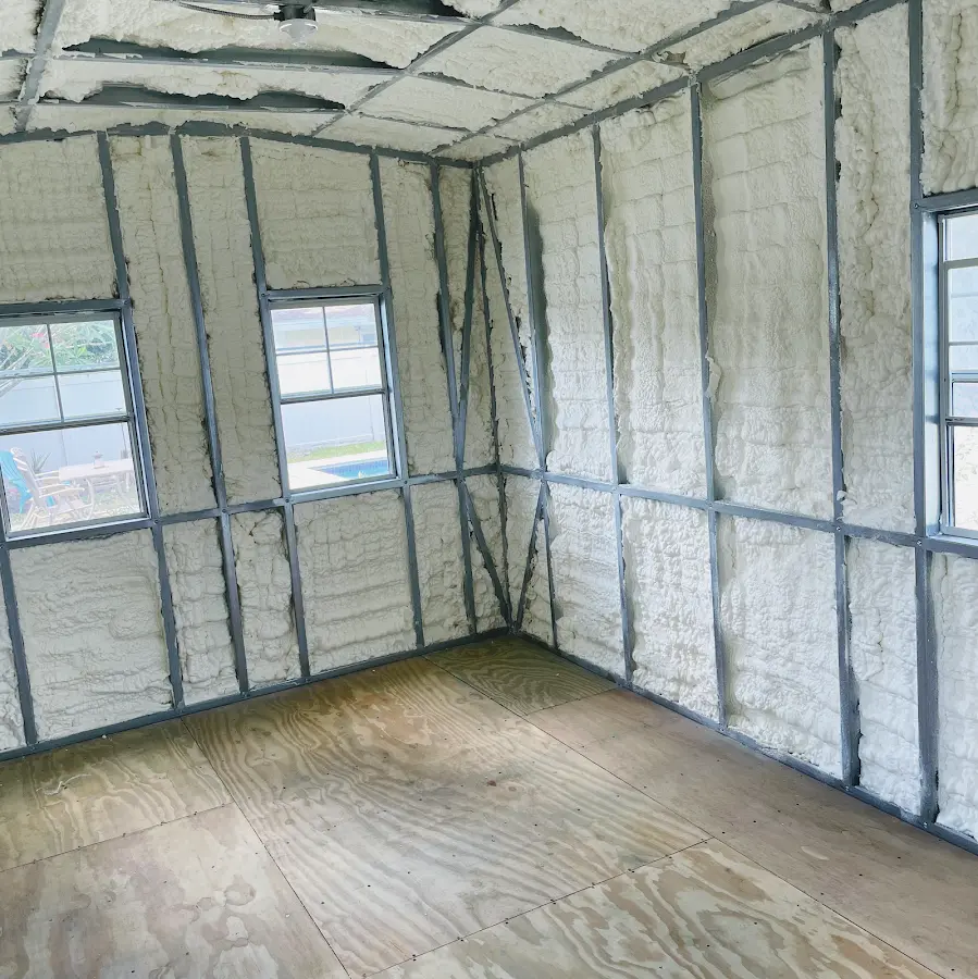 Closed-cell spray foam insulation applied to wall cavities in a residential project in Roma